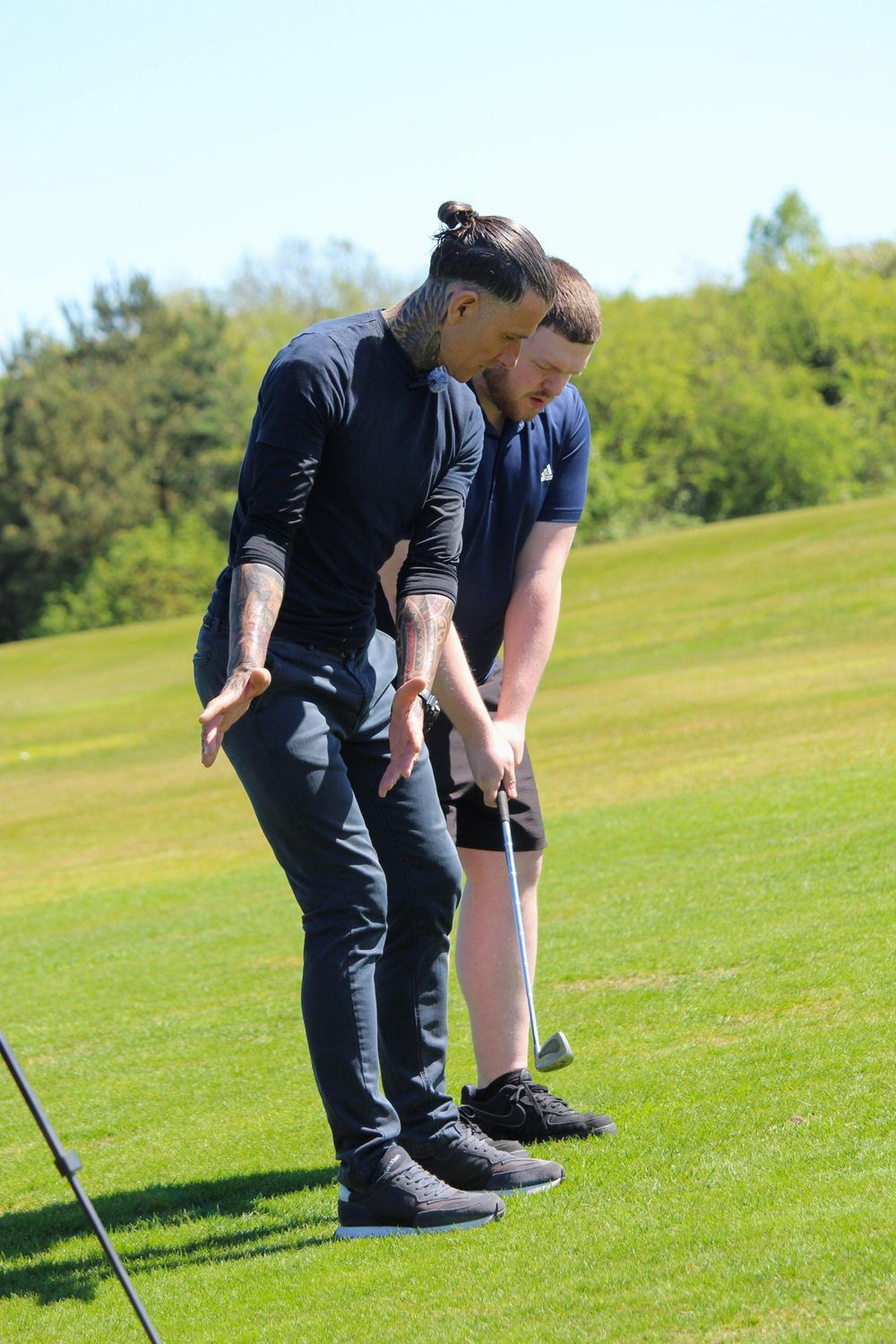 Chipping coaching beside the green during a playing lesson